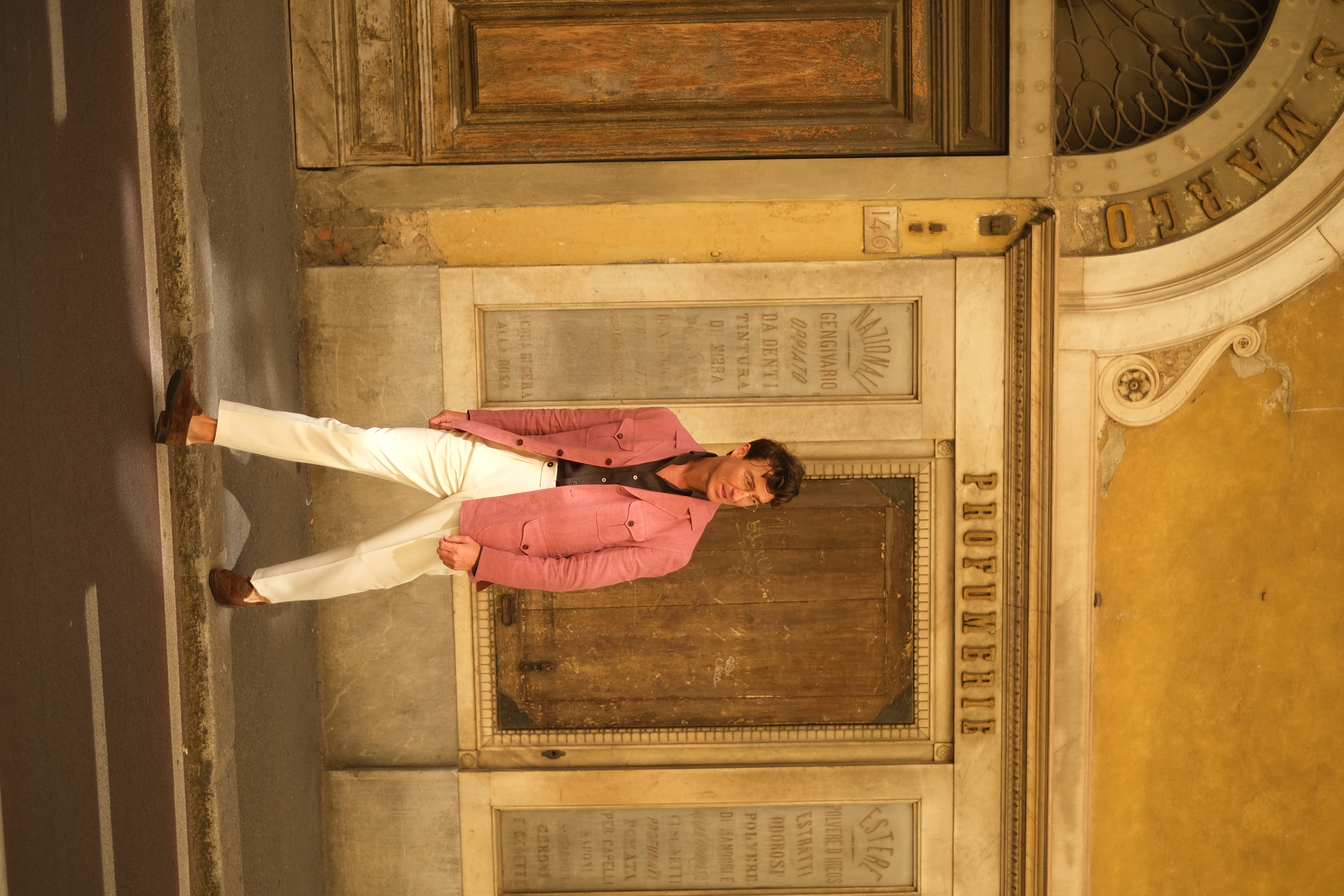 Anton Masko in raspberry safari jacket and ivory wool trousers, Florence